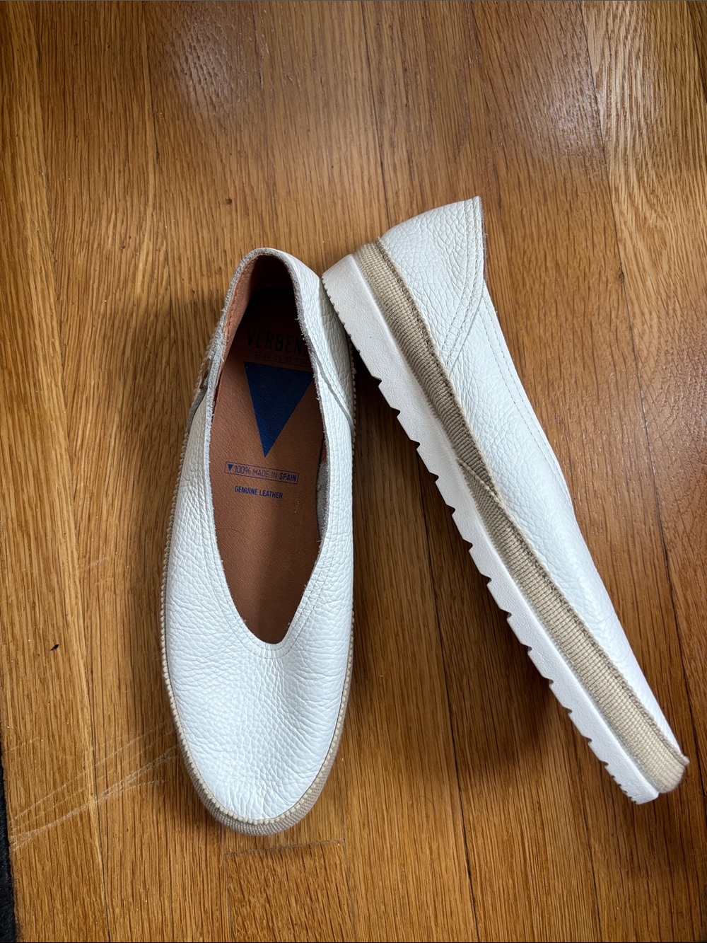 White Pebbled Leather Slip-On Flats with Neutral Trim by Verbenas